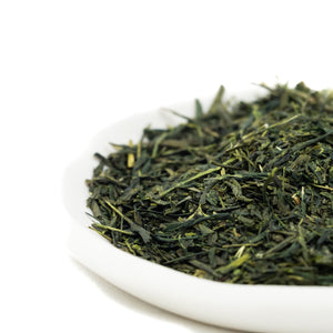 TEA MATE Australian Alpine Loose Leaf Green Tea. Green tea leaves on a white plate. Australian grown and farmed tea tea.